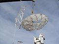 The nearly complete antenna is lifted to the pedestal.